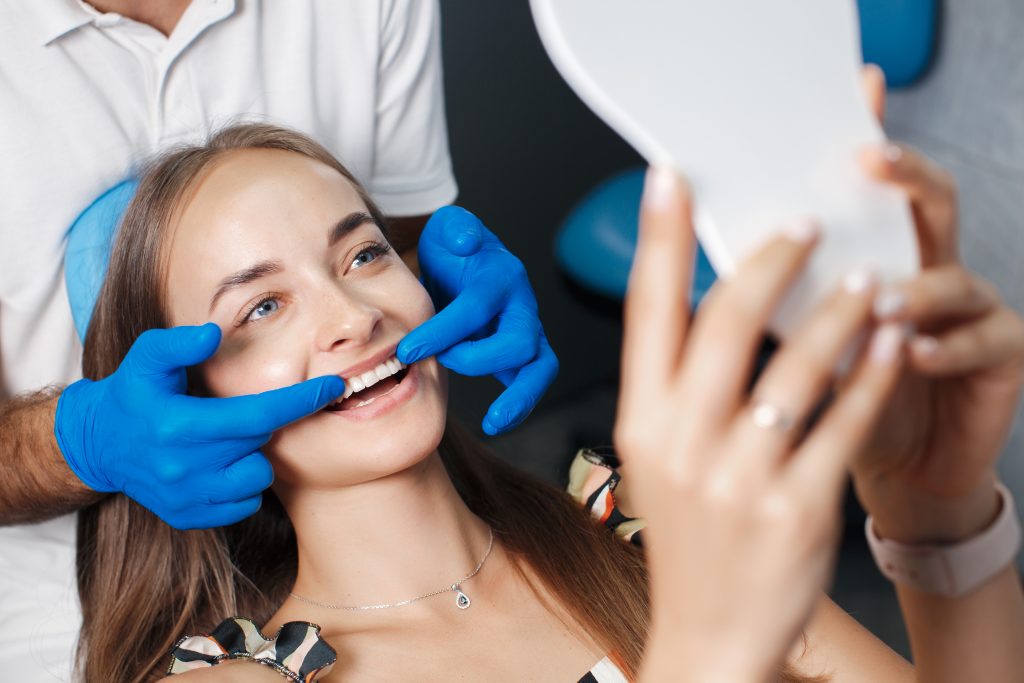 patient happily smiling after getting composite bonding